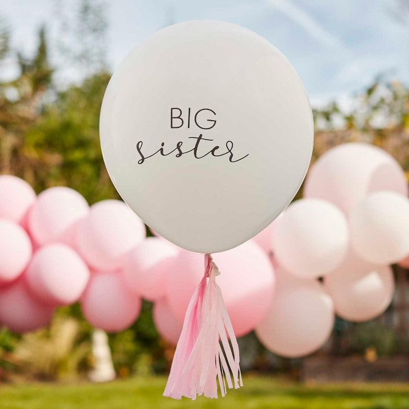 "18-inch white latex 'Big Sister' balloon with pink tassels, perfect for celebrating new siblings and baby showers."