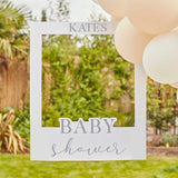 Off-white photo booth frame for baby showers, measuring 72cm x 60cm, includes vinyl stickers for customization.