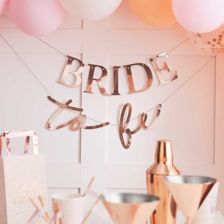 Rose gold "Bride To Be" banner for hen parties, 1.5m cardboard bunting, elegant decoration for memorable celebrations.