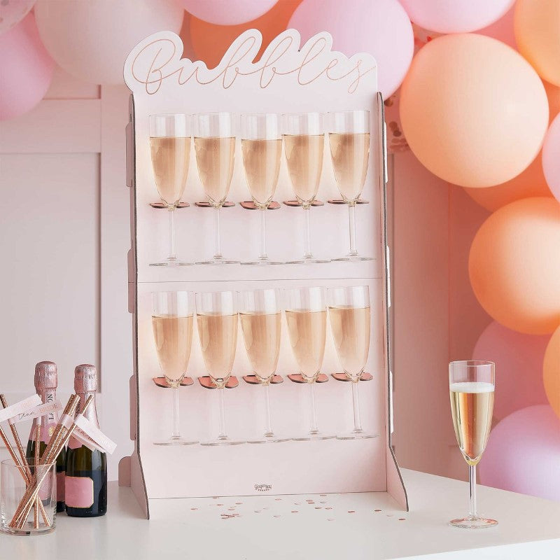 Rose gold foiled and blush prosecco wall, 69cm tall, with 10 holders and 2 stands for elegant drink displays at events.