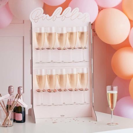 Rose gold foiled and blush prosecco wall, 69cm tall, with 10 holders and 2 stands for elegant drink displays at events.