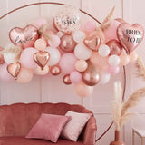 Pink, white, peach, and rose gold balloon arch kit with 80 balloons for stunning hens party decorations.