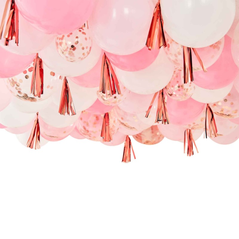 Blush white and rose gold ceiling balloons with tassels, perfect for elegant celebrations and adding charm to any event.