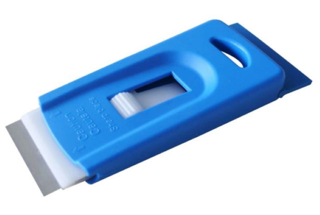 Mini blue floor and window scraper for removing gum and marks from surfaces, ideal for tight spaces and deep cleaning.