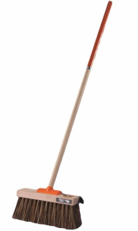 Heavy-duty yard broom with stiff bristles, ideal for sweeping debris and fine dust outdoors; features a durable timber handle.