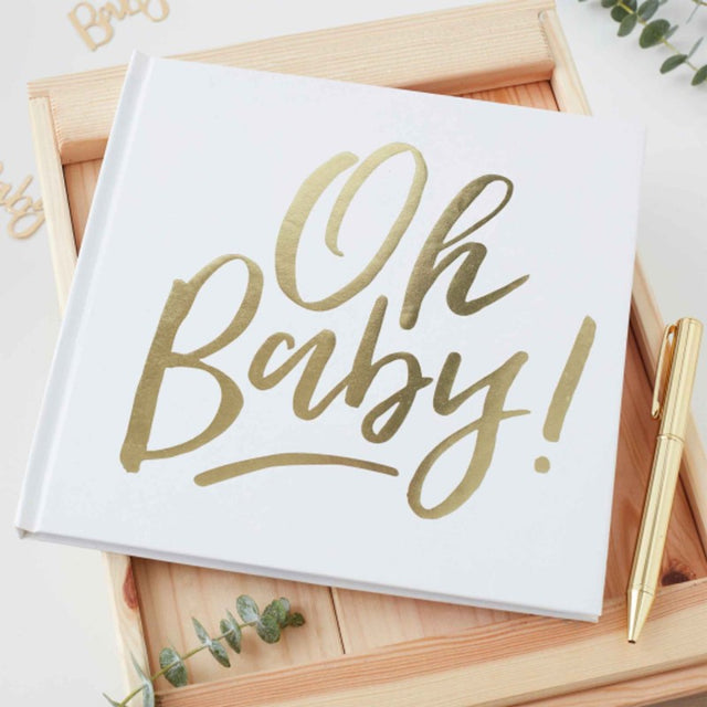 Elegant white and gold "Oh Baby!" guest book for baby showers, featuring blank pages for messages and memories.