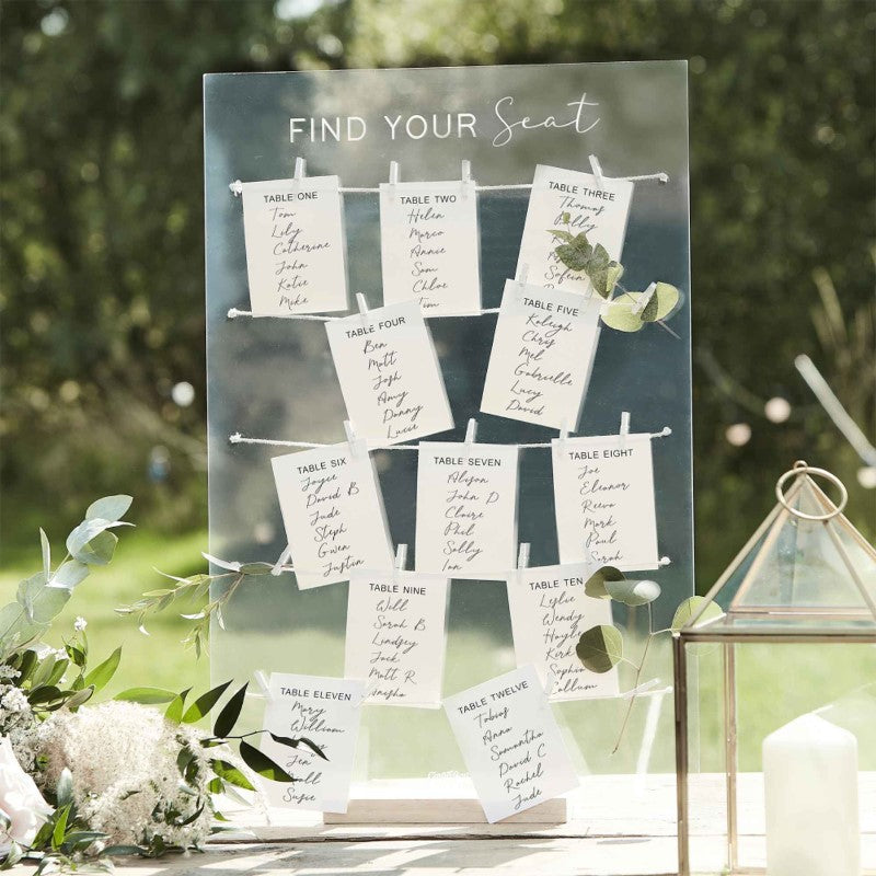 Acrylic wedding table plan with wooden stand and 12 labeled cards, perfect for guiding guests to their seats.