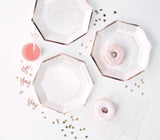 Pack of 8 stylish 25cm rose gold paper plates with a spotty design, perfect for elegant party decor and easy cleanup.