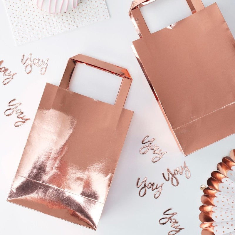 Elegant pack of 5 rose gold party bags, perfect for favors at celebrations, shimmering with a stylish metallic finish.