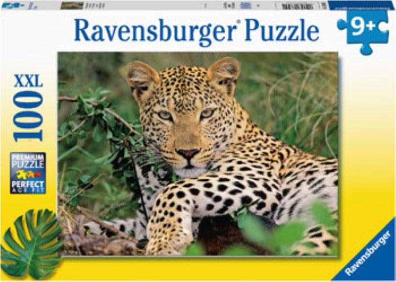 Colorful 100-piece puzzle featuring a lounging leopard in lush foliage, designed for kids aged 6 and up.