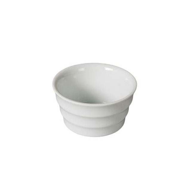 Set of 4 elegant white porcelain ramekins, perfect for serving sauces and desserts at any dining occasion.