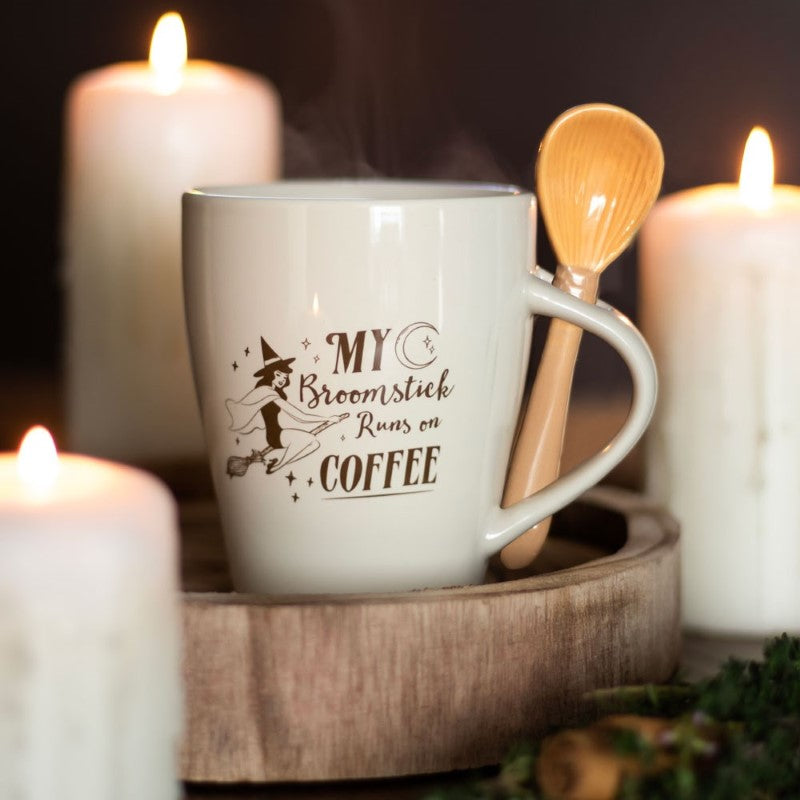 Enchanting coffee mug set featuring a flying pin-up witch and broom teaspoon, perfect for magical morning brews.