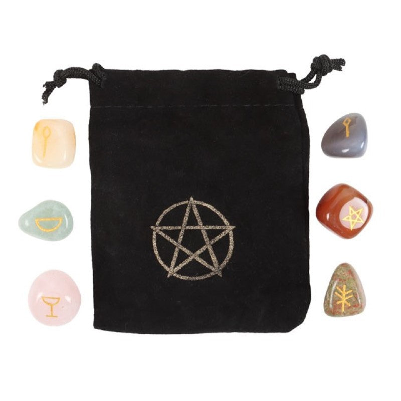A mystical crystal gift set with six unique tumblestones, a casting chart, and a velvet bag for spiritual practices.