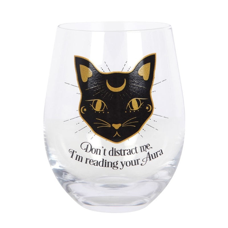 Stemless wine glass featuring a playful black cat and whimsical 'Don't distract me, I'm reading your aura' phrase, 500ml capacity.