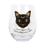 Stemless wine glass featuring a playful black cat and whimsical 'Don't distract me, I'm reading your aura' phrase, 500ml capacity.
