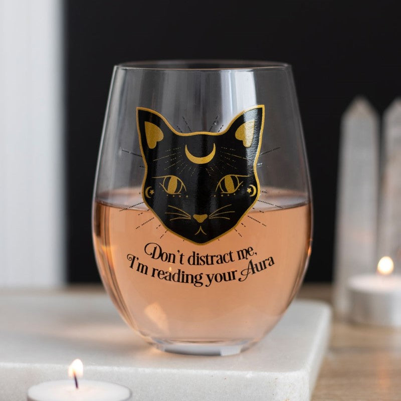 Stemless wine glass featuring a playful black cat and "Don't distract me, I'm reading your aura" text, 500ml capacity.