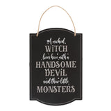 Whimsical hanging sign reading 'A Wicked Witch Lives Here' with spooky design, perfect for Halloween family decor.