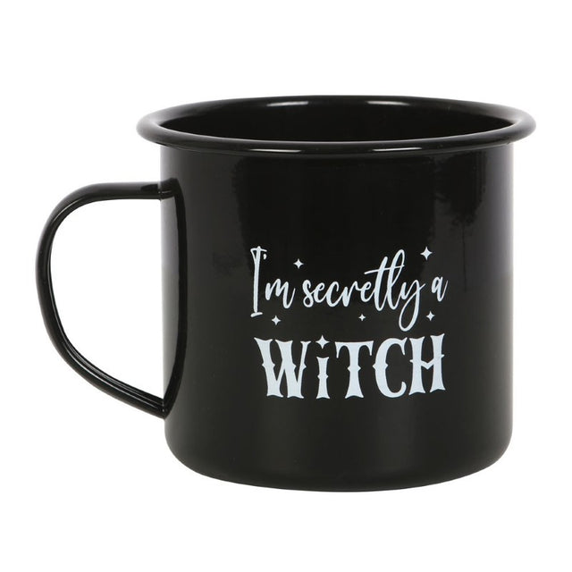 Enamel mug with "I'm Secretly A Witch" text on a black base, perfect for sipping hot beverages and Halloween décor.
