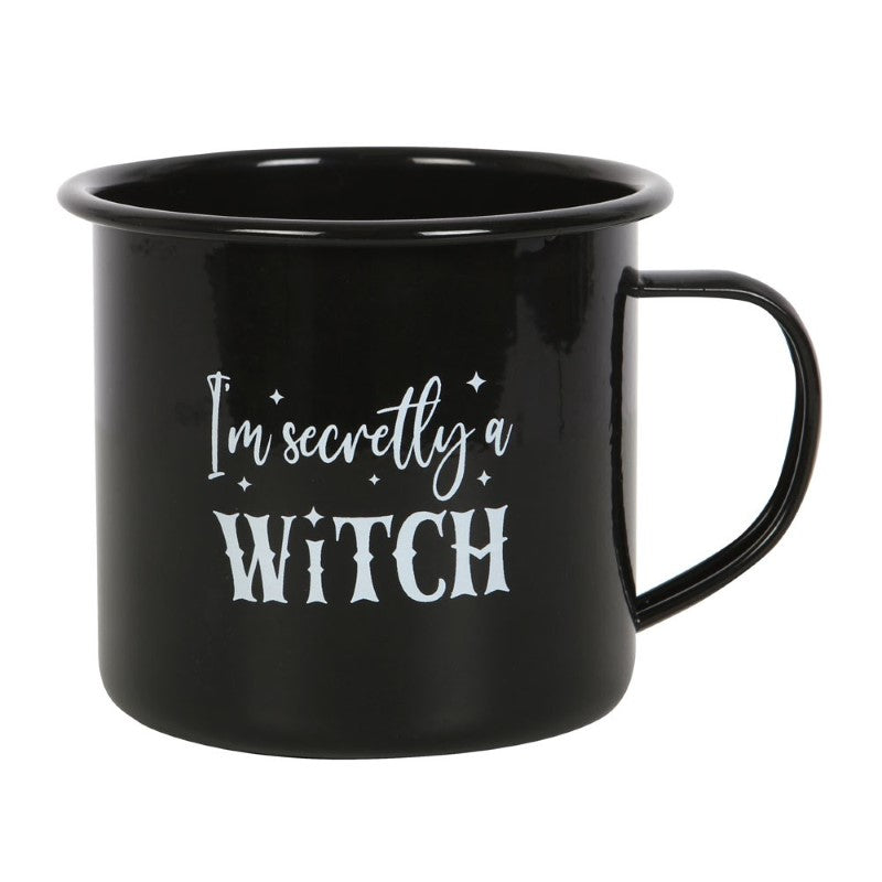 "I'm Secretly A Witch Enamel Mug" with whimsical text on a sleek black base, perfect for hot beverages and witchy vibes.