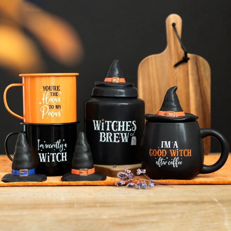 Set of 2 enamel mugs with whimsical witch-themed sayings, perfect for coffee or tea lovers and Halloween decor.