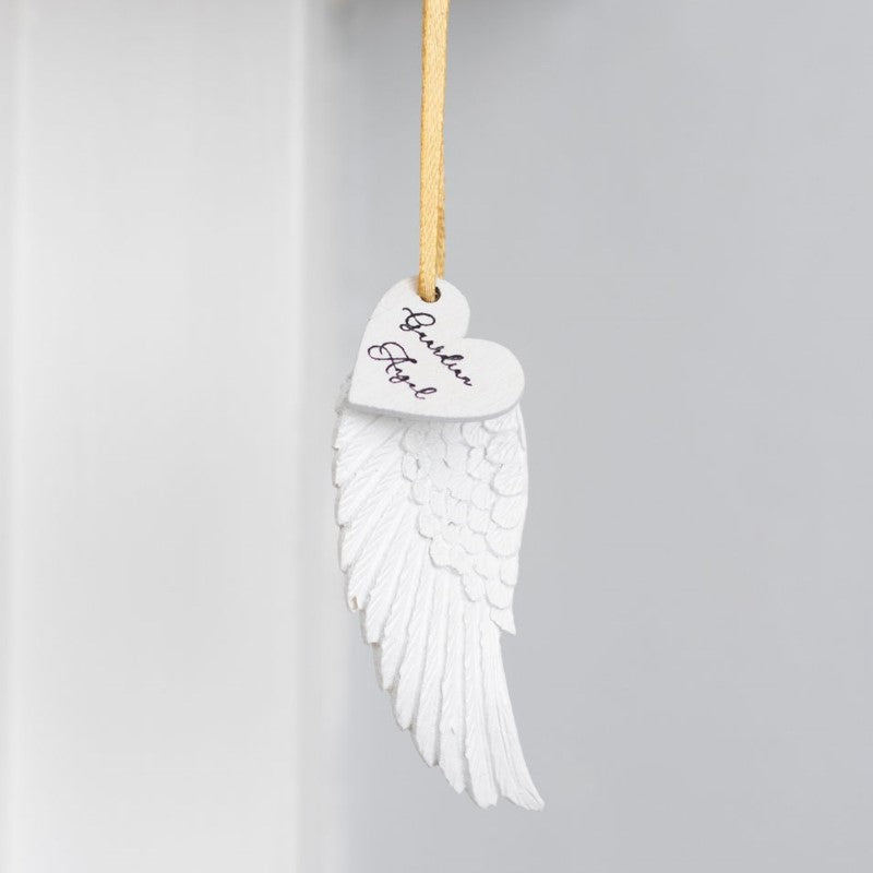 Delicate guardian angel wing ornament with gold ribbon, symbolizing protection and love; perfect for home decor or gifts.