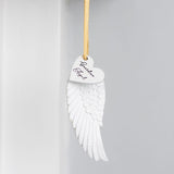 Delicate guardian angel wing ornament with gold ribbon, symbolizing protection and love; perfect for home decor or gifts.
