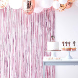 Matte pink fringe curtain backdrop standing 2.2m high, perfect for parties and photo opportunities.