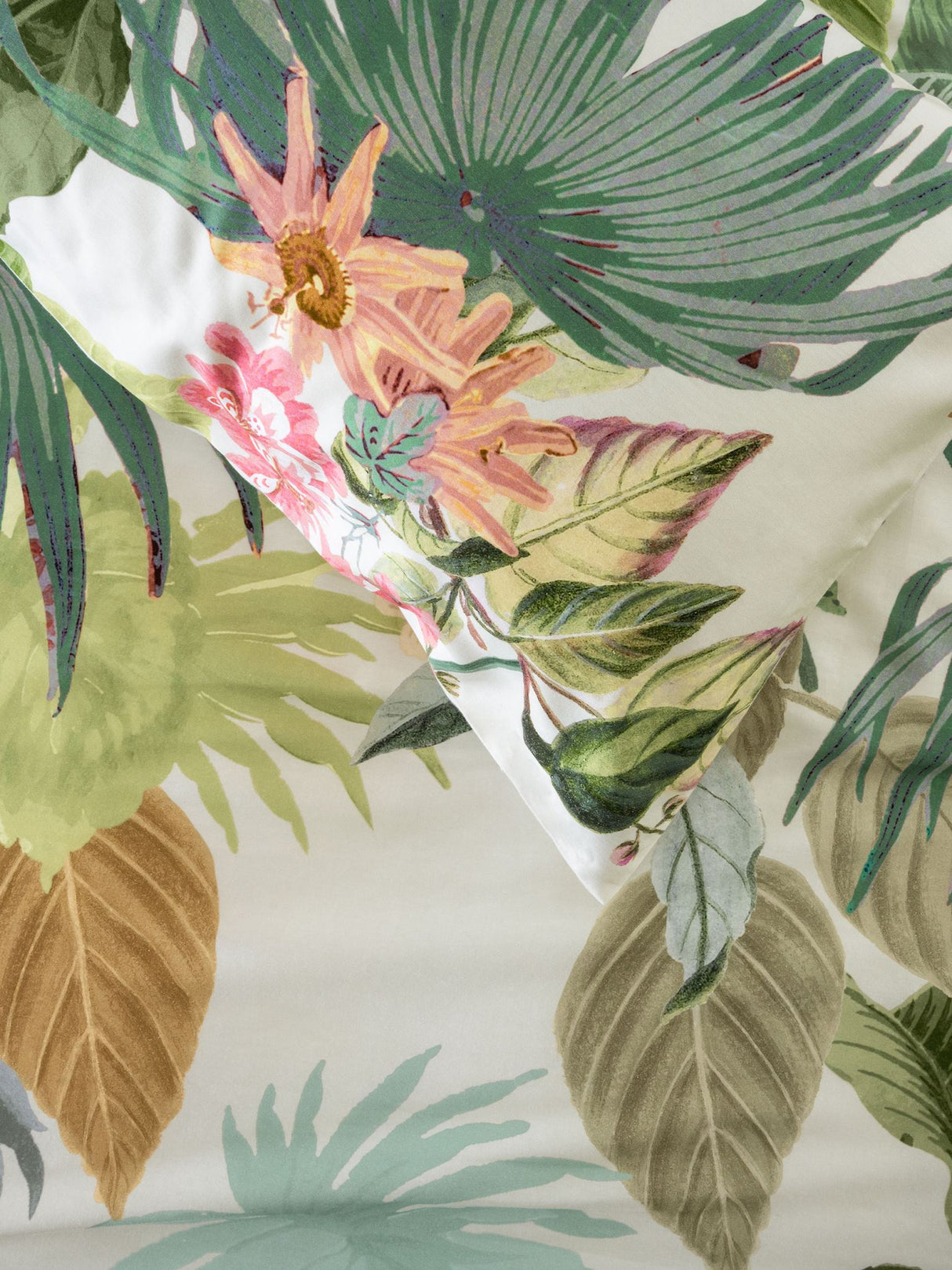 King duvet cover set featuring exotic hand-painted florals on a vanilla cotton sateen base in vibrant green and coral hues.