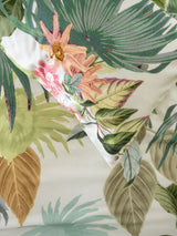 King duvet cover set featuring exotic hand-painted florals on a vanilla cotton sateen base in vibrant green and coral hues.