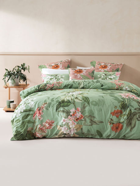 King duvet cover set by Savona featuring a floral design in earthy pinks, rusty orange, and greens on a soothing background.