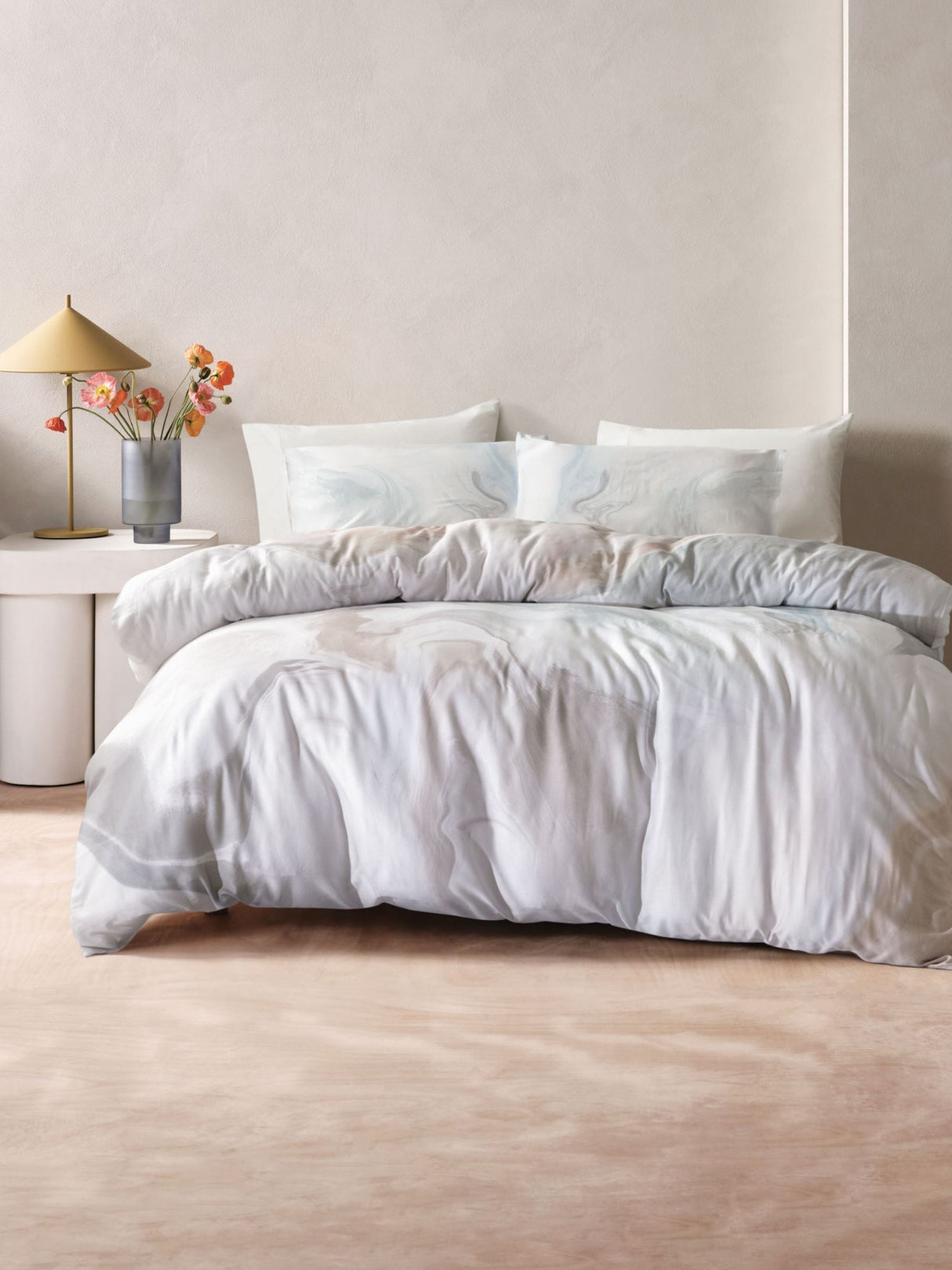 Grey Wondrous Duvet Cover Set by Savona, a queen size cotton sateen set featuring earthy neutrals and a flowing marbled design.