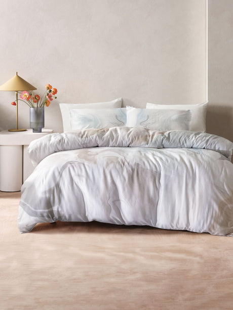 Grey Wondrous Duvet Cover Set by Savona, a queen size cotton sateen set featuring earthy neutrals and a flowing marbled design.