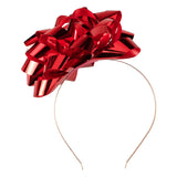 Vibrant red bow Christmas headband, perfect for festive celebrations and eco-conscious holiday spirit.