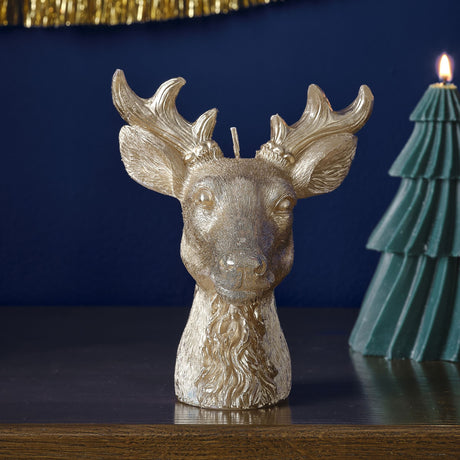 Gold stag candle measuring 16.4cm x 13.8cm, perfect for festive decor and creating a warm holiday ambiance.