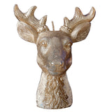 Gold stag candle shining warmly, perfect for festive decor and eco-friendly gatherings this holiday season.