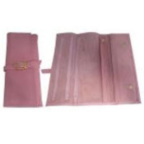 Light pink genuine leather jewellery roll with three zipper compartments, ring holder, and secure buckle closure for travel.