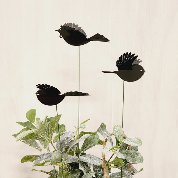 Elegant Mini Black Robin plant stake with 3D wings, perfect for enhancing gardens and floral displays.