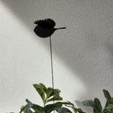 Mini black robin plant stake with vibrant wings, adding whimsy and elegance to gardens and floral arrangements.