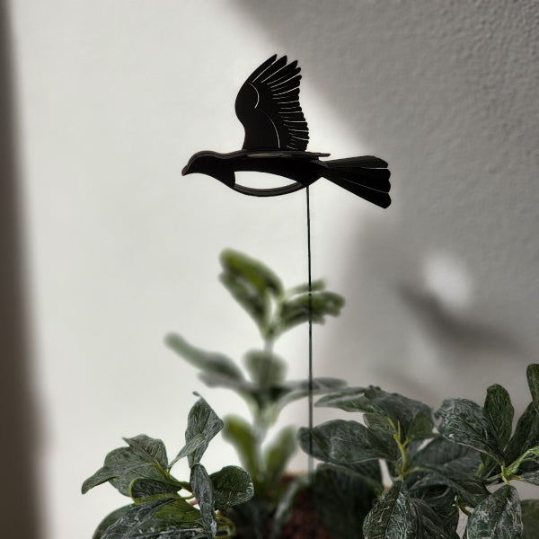 Mini Kereru plant stake featuring intricate 3D wings, 40cm tall, adds whimsical charm to indoor and outdoor plants.