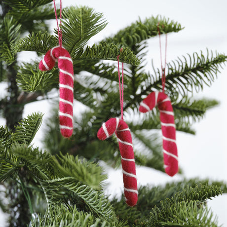 Handcrafted felt candy cane decorations with red twine, perfect for adding festive charm to your Christmas decor.