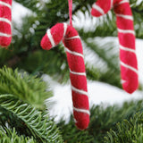 Handmade felt candy cane decorations, 8cm high, adorned with red twine, perfect for festive holiday decor.