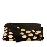 100% cotton throw blanket with gold metallic dots on black, perfect for cozying up in style and elegance.