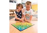 Colorful Snakes and Ladders game board with vibrant pieces for 2-4 players, promoting fun and strategic play.