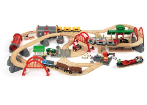 Colorful BRIO Deluxe Railway Set with 87 pieces, featuring trains, stations, cranes, and bridges for imaginative play.