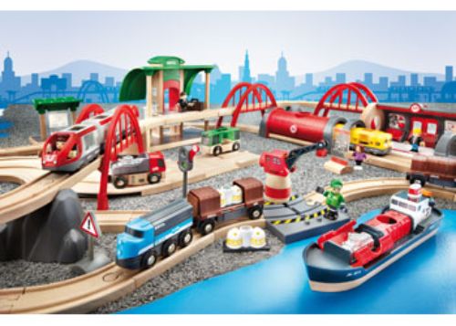 Colorful BRIO Deluxe Railway Set with 87 pieces featuring trains, stations, and harbour scenes for imaginative play.