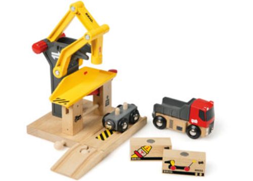 Colorful BRIO Freight Goods Station set featuring a truck, wagon, and magnetic cargo loader for imaginative play.