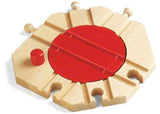 Wooden BRIO mechanical turntable for train sets, featuring smooth tracks and a button-operated design for imaginative play.