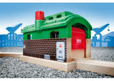 Wooden BRIO train garage with rotating knob, features storage and a tunnel for imaginative railway adventures.