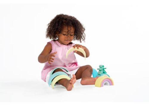 Pastel wooden rainbow toy set with 12 pieces, fostering creativity and developmental play for toddlers.