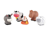 Colorful figurines of Happyland farm animals including a pig, cow, horse, chicken with chicks, and sheep on vibrant green grass.